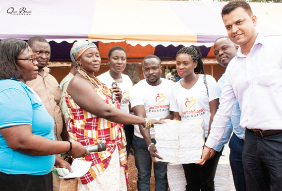 Martha, (3rd right) and her team making a presentation at one of the communities