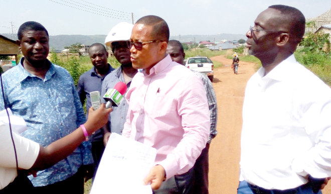 Mr William Boateng (right) flanked by some officials of the ECG including Mr Seth Mensah (left) speaking to the media. Inset: One of the secondary transformers installed in the Electricity Company of Ghana (ECG) Dodowa District.