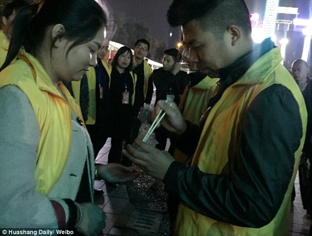 Chinese employees are forced to eat live worms after failing to reach sales targets 