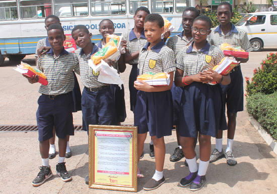 Some students of the L&amp;A Memorial Academy at Mallam Gbawe in Accra displaying their awards after the Papaye Excellence Awards ceremony