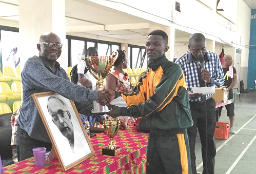 Emmanuel Ofori (right) receiving the trophy and Hathiramani portrait from Dr S. A. Quaye, a trustee of the Hathiramani Fund Emmanuel Ofori (right) receiving the trophy and Hathiramani portrait from Dr S. A. Quaye, a trustee of the Hathiramani Fund