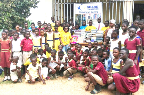 Nana A. Adjeiwaa Kordie (arrowed) poses with some of the students and teachers during the presentation ceremony