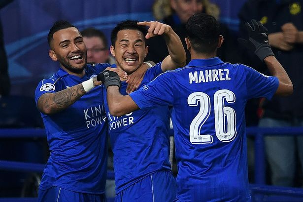 Shinji Okazaki celebrates scoring the opener for Leicester Shinji Okazaki celebrates scoring the opener for Leicester