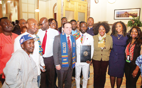 Okyeame Kwame (fourth right) and John Cranley Mayor of Cincinati (fourth left) and other officials after the ceremony