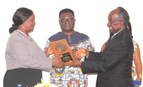 Dr Kofi Mbiah (middle), CEO, Ghana Shippers’ Authority, assisted by Prof. Samuel Date-Bah, presenting a plaque to the Chief Justice, Her Ladyship Justice Georgina Theodora Wood Dr Kofi Mbiah (middle), CEO, Ghana Shippers’ Authority, assisted by Prof. Samuel Date-Bah, presenting a plaque to the Chief Justice, Her Ladyship Justice Georgina Theodora Wood