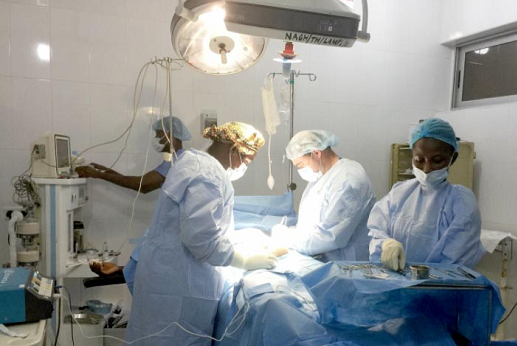 The American team performing surgical operation on a patient The American team performing surgical operation on a patient