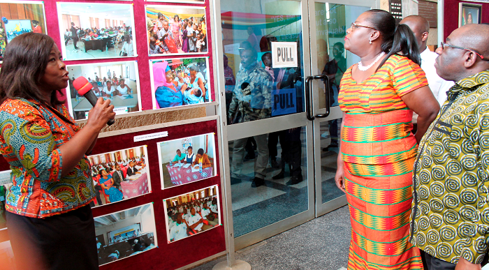 An official of the Department of Children of the Ministry of Gender, Children and Social Protection briefing Nana Oye Lithur (2nd right) and Mr Edward Ato Sarpong (right) on some of the Department’s works. Picture: EDNA ADU-SERWAA