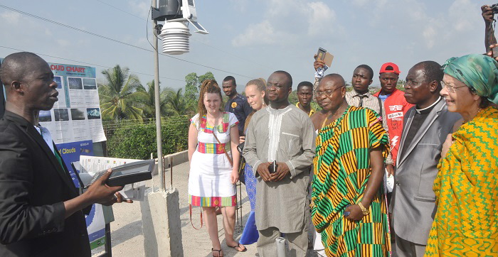 Mr Kellicks Frimpong Boateng (left), a Geography tutor at the Westphalian Senior High School, explaining how the Digital Weather Station works. Looking on are Mrs Zumbdiek (right), President, International Union of Westphalian Children’s Villages in Germany; Nana Amoako Amankwa (3rd right), Kyidomhene of Oyoko Breman, and Mr Phillip Basoah (3rd left), MP for Kumawu