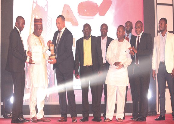 Mr Nichol J. Elizabeth (3rd left), a representative of Pioneer Food Cannery, picking the Overall Best Award from Mr Muturla Mohammed (2nd left) Mr Nichol J. Elizabeth (3rd left), a representative of Pioneer Food Cannery, picking the Overall Best Award from Mr Muturla Mohammed (2nd left)