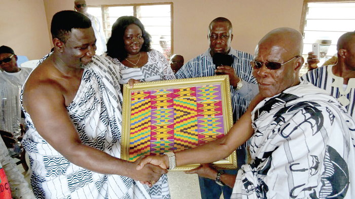 Andy Osei Okrah (left) receiving the gift from Nana Kwakye Berko Dankagyeabour, the Adanwomase Nkosuohene Andy Osei Okrah (left) receiving the gift from Nana Kwakye Berko Dankagyeabour, the Adanwomase Nkosuohene