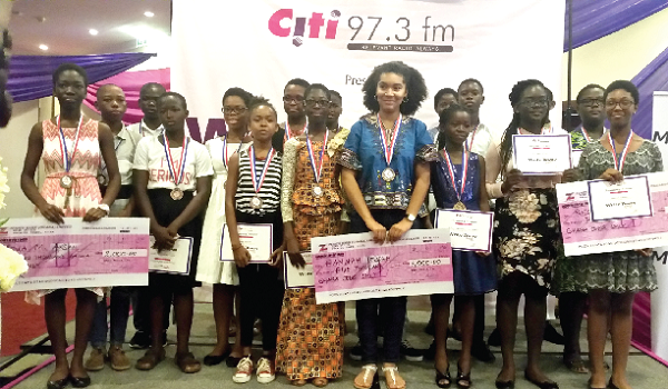 The winner of the Citi Fm Write Away Contest, Hannah Yeboah (middle)  with other competitors