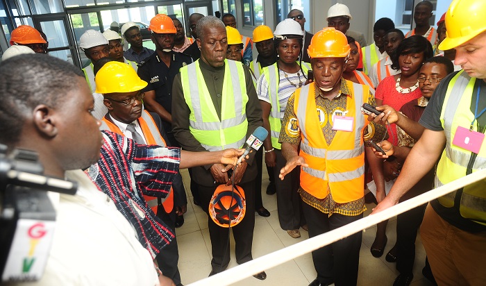 Professor Aaron Lawson ,Project Manager of the University of Ghana Teaching project briefing Vice President Kwesi Amissah Arthur on the project when he inspected the project .Picture by Emmanuel Quaye 