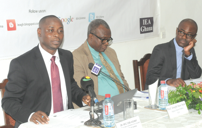 Dr Eric Osei-Assibey (left), delivering his presentation. With him are Dr Micheal Ofori-Mensah (right), Senior Research Fellow, IEA Ghana, and Prof. Joseph Atsu Ayee, Senior Adjunct Fellow, IEA Ghana Dr Eric Osei-Assibey (left), delivering his presentation. With him are Dr Micheal Ofori-Mensah (right), Senior Research Fellow, IEA Ghana, and Prof. Joseph Atsu Ayee, Senior Adjunct Fellow, IEA Ghana