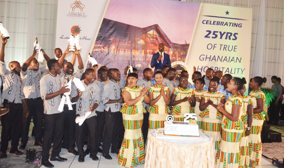 Staff of the hotel popping champagne to celebrate the evening Staff of the hotel popping champagne to celebrate the evening