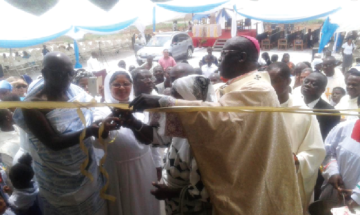 Most Rev. Gabriel Justice Yaw Anokye (right) being assisted by the Odikro of Darban, Nana Adu Gyamfi II (left), the Headmistress, Rev. Sister Suja Alphonsa (middle), and other dignitaries to cut the tape to inaugurate the building (inset) Most Rev. Gabriel Justice Yaw Anokye (right) being assisted by the Odikro of Darban, Nana Adu Gyamfi II (left), the Headmistress, Rev. Sister Suja Alphonsa (middle), and other dignitaries to cut the tape to inaugurate the building (inset)