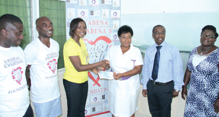 Kwabena Kwabena (2nd left) and his team making the presentation Kwabena Kwabena (2nd left) and his team making the presentation