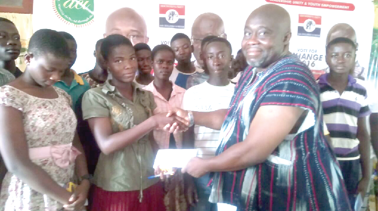 • Nenyi Andah (right) presenting a scholarship letter to one of the beneficiaries • Nenyi Andah (right) presenting a scholarship letter to one of the beneficiaries