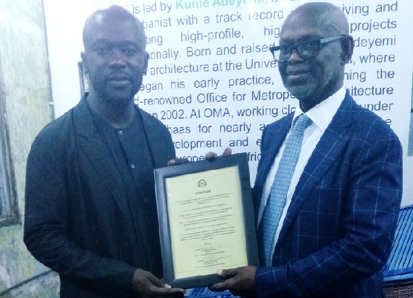Mr David Adjaye (leftt) receiving the citation from Professor Kwesi Botchwey, Chairman of the NDPC Mr David Adjaye (leftt) receiving the citation from Professor Kwesi Botchwey, Chairman of the NDPC