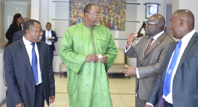 Dr Ekwow Spio Garbrah (2nd left), Trade and Industry Minister, interacting with Mr Alhassan Andan (left), CEO, Stanbic Bank Ghana, Dr Ernest Kofi Asimenu Jnr. (2nd right) and Mawuko Afadzinu (right), both of Stanbic Bank, after the minister had addressed the conference. Pictures: DOUGLAS ANANE FRIMPONG