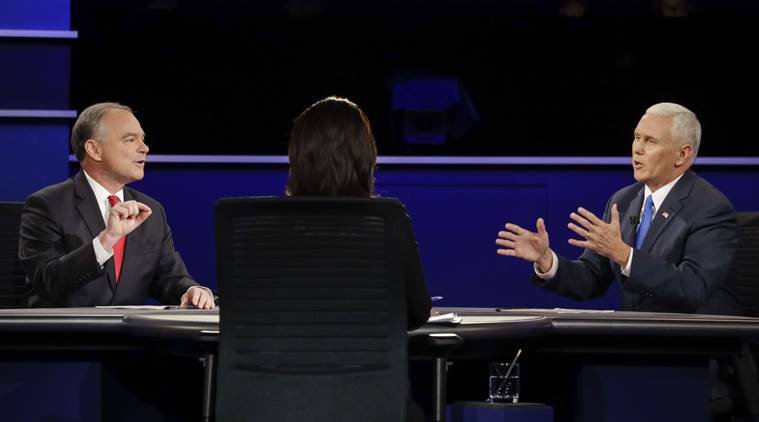 Tim Kaine (left) and Mike Pence engaged in a heated argument US election: Trump 'fool' and Clinton 'weak', say VPs