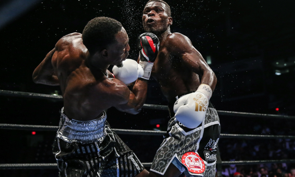 Easter landing a hard uppercut on Commey Easter landing a hard uppercut on Commey