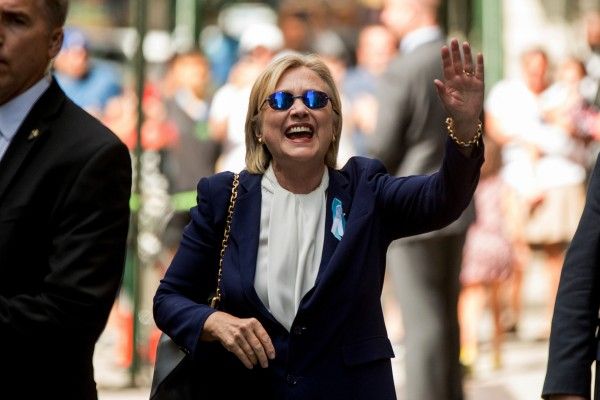 Mrs Clinton waved to photographers after she left her daughter's home in New York Mrs Clinton waved to photographers after she left her daughter's home in New York