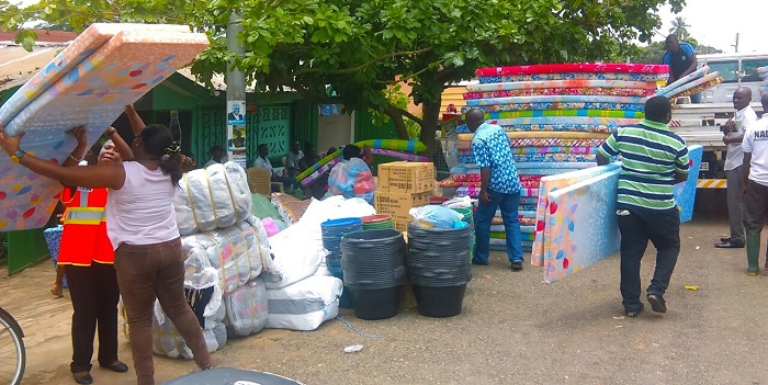 Officials of the Eastern Regional National Disaster Management Organisation (NADMO) distributing relieve items to some of the victims of the flooding in Koforidua Officials of the Eastern Regional National Disaster Management Organisation (NADMO) distributing relieve items to some of the victims of the flooding in Koforidua