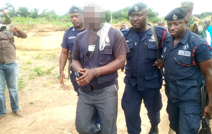 The first culprit arrested at a building site at Owabi being escorted by the police The first culprit arrested at a building site at Owabi being escorted by the police
