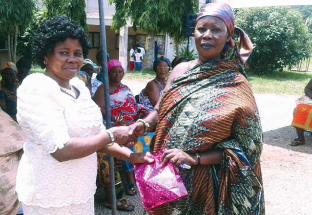 The DCE for Bosomtwe, Madam Veronica Antwi-Adjei (left), presenting a parcel to Nana Fremah Tatuoh, Mimhemaa, during the durbar at Kuntanase Assembly celebrates ‘Queenmothers’ Day’