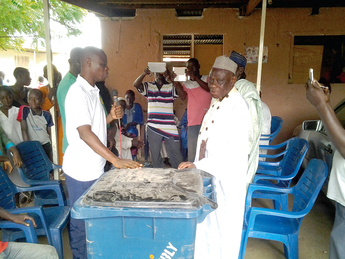 The Municipal Chief Executive for Bolgatanga, Mr Philip Adongo Aboore, donating one of the waste bins to the Regional Chief Imam, Alhaji Yussif Adam. Sabon Zongo residents participate in sanitation exercise through intervention of soldiers, Bolga assembly
