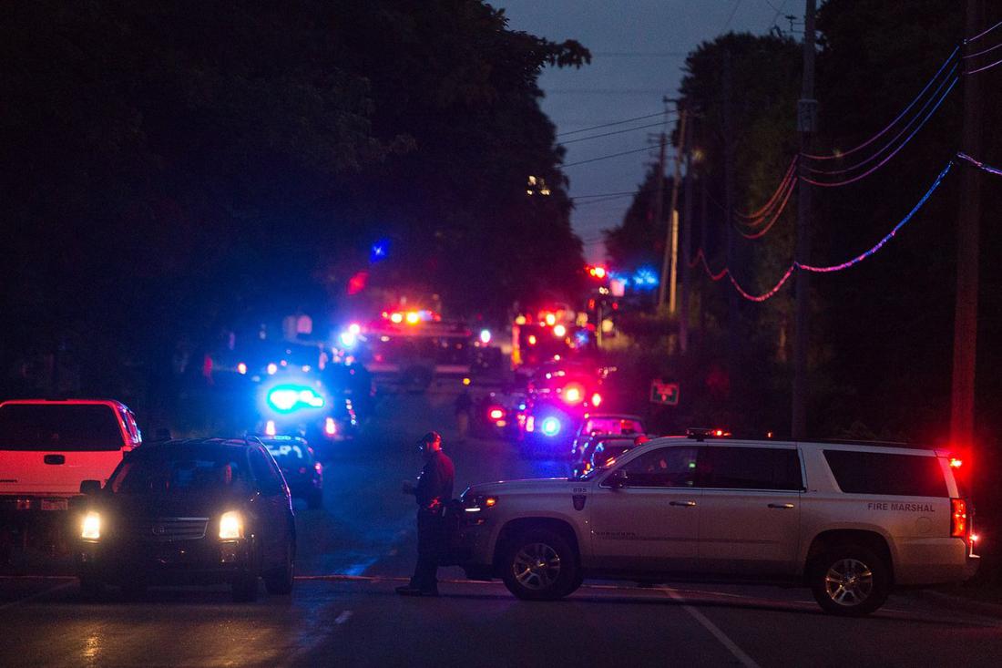 Police investigate the scene after multiple bicyclists were struck in a deadly crash in Cooper Township, Mich. on June 7, 2016. Hit-and-run driver kills 5 cyclists in Michigan