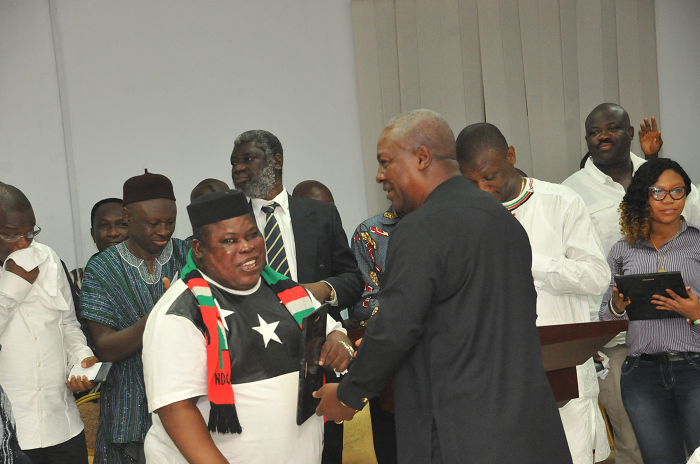 The President applauding Jewel Ackah, one of the recipients of the awards. Picture: EBOW HANSON NDC honours 55 founder members