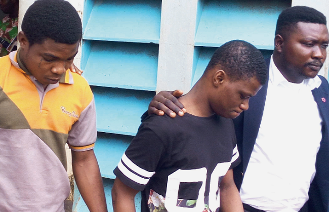 Daniel Asiedu (2nd right) and Vincent Bosso being escoted from the court premises. Picture: EBO HAWKSON Prosecution builds case against killers of JB