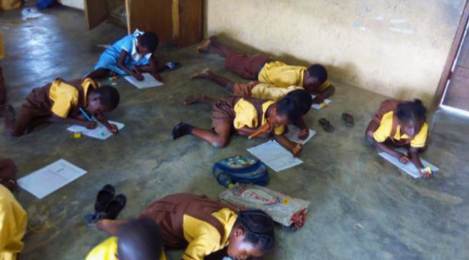 Pupils of Mmaampehia writing on the floor during classes hours Any helping hand for Mmaampehia village?