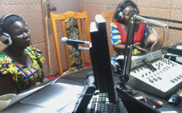 Ms Philomena Aboko (right) , the host of Nabina FM, having a radio discussion with some of the members of Our Lady of Mercy (OLAM) Kaana Manga Women Association on the manifesto Navrongo women want party manifestos out