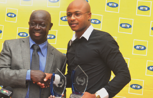 Andre Ayew proudly receives the SWAG Sportsman of the Year award from SWAG president, Kwabena Yeboah