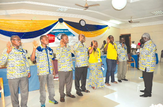 Mr Kofi Asamoah, the Secretary General of TUC Ghana, swearing-in the new leadership of the Maritime and Dockworkers Union. In the middle is Mr Daniel Owusu-Koranteng, the General Secretary of MDU Maritime and Dockworkers Union holds delegates confab
