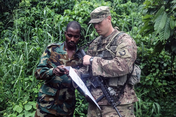 Ghana Armed Forces Sgt. Kofi Francis Donkor reviews his position on a map with U.S. Army 2nd Lt. Hugh Smith during United Accord 2017 at the Jungle Warfare School on Achiase military base, Akim Oda, Ghana, May 26, 2017. BRIAN CHANEY/U.S. ARMY Ghana Armed Forces Sgt. Kofi Francis Donkor reviews his position on a map with U.S. Army 2nd Lt. Hugh Smith during United Accord 2017 at the Jungle Warfare School on Achiase military base, Akim Oda, Ghana, May 26, 2017. BRIAN CHANEY/U.S. ARMY
