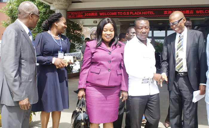 Mr Kwesi Owusu Boadu (2nd right), Mr Charles Okoro (far right), a resource person, and other ECOWAS standardisation experts  interacting after the workshop in Accra. Picture: GABRIEL AHIABOR
