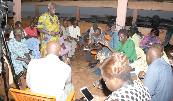 Nana Kofi Bentsil (standing), chief fisherman at the Axim landing beach, interacting with the media. Pictures: GABRIEL AHIABOR Nana Kofi Bentsil (standing), chief fisherman at the Axim landing beach, interacting with the media. Pictures: GABRIEL AHIABOR