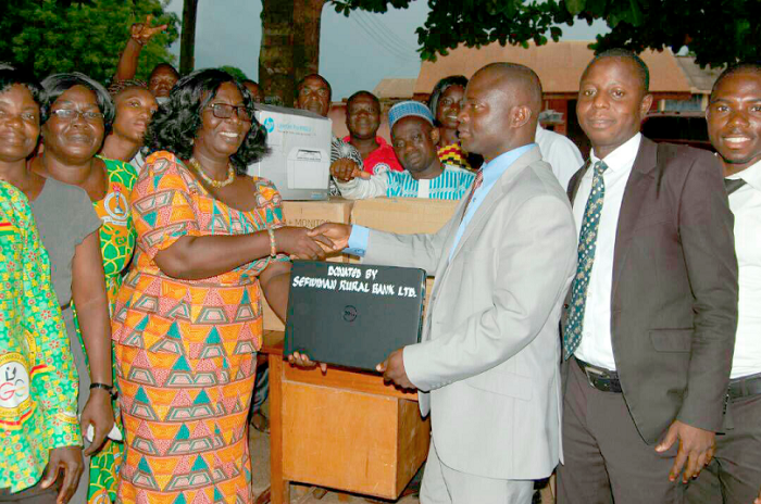 Mr Richard Kwaku Adjei (right) presenting the items to Mrs Mercy Emefa Boateng Mr Richard Kwaku Adjei (right) presenting the items to Mrs Mercy Emefa Boateng