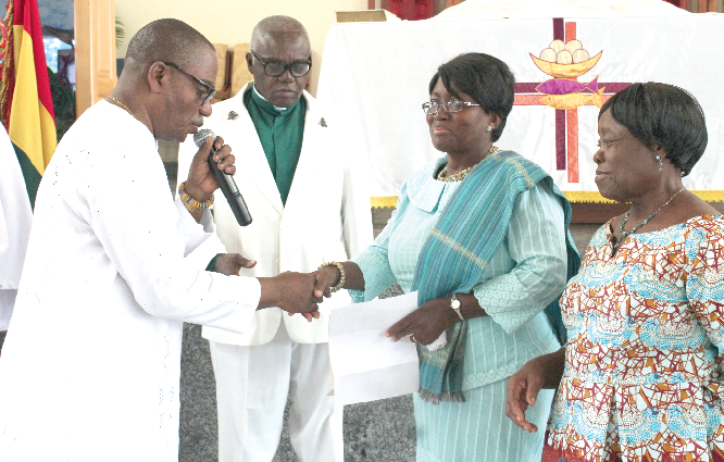 Prof Lorna Awo Renner (2nd right), Head of the Department of Child Health, Korle-Bu, receiving the cash from Mr Abeeku Arthur (left), Steward of the Immanuel Society of the Methodist Church. Looking on is Very Rev John K Appiah-Acheampong (2nd left), Superintendent Minister of the East Airport Circuit. Picture: Maxwell Ocloo Prof Lorna Awo Renner (2nd right), Head of the Department of Child Health, Korle-Bu, receiving the cash from Mr Abeeku Arthur (left), Steward of the Immanuel Society of the Methodist Church. Looking on is Very Rev John K Appiah-Acheampong (2nd left), Superintendent Minister of the East Airport Circuit. Picture: Maxwell Ocloo