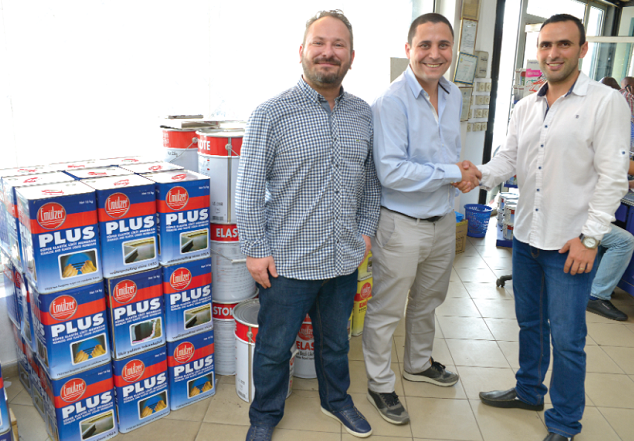 The General Manager of City Paints, Mr Zeyad Khouryhanna (right), in a handshake with Mr Cagkan Goymat. With them is Mr Can Sahan from Emulzer.