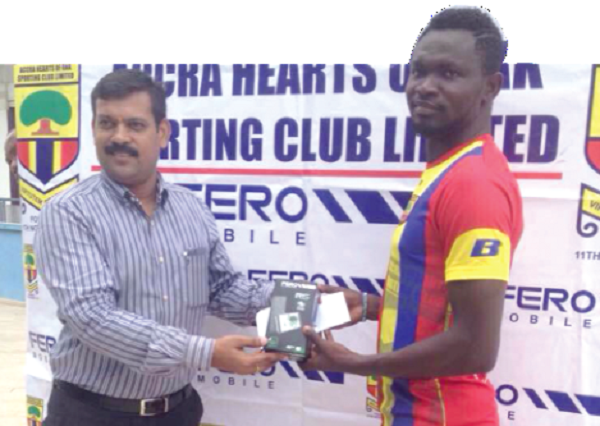 Vincent Atinga (right) receiving his prize from Ajit Jain Vincent Atinga (right) receiving his prize from Ajit Jain