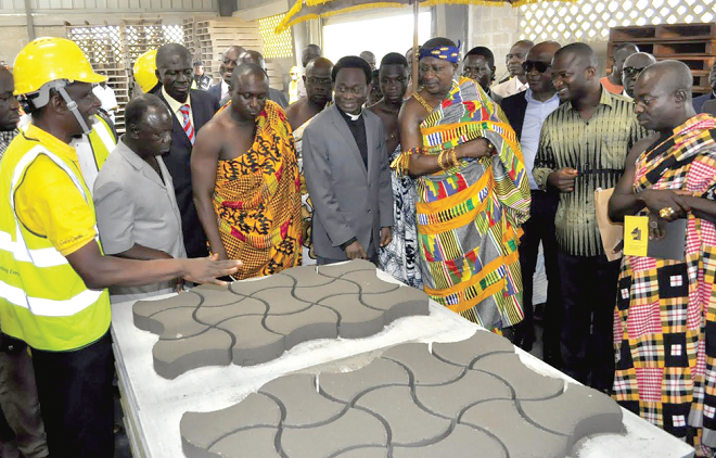 Mr Eric Duku (left) briefing dignitaries on operations of the company Mr Eric Duku (left) briefing dignitaries on operations of the company