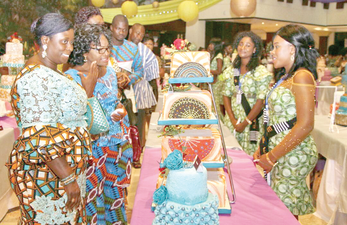 • Mrs Efua Goode Obeng-Kyei (1st left) and some special guests interacting with two members of the graduating class during the cake inspection • Mrs Efua Goode Obeng-Kyei (1st left) and some special guests interacting with two members of the graduating class during the cake inspection