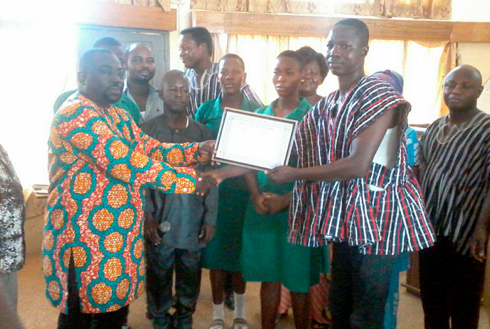 • Mr Peter Ayamga (left) handing over a certificate to Mr Timothy Atanga, a teacher at Azeem-Namoa Senior High Technical School which won the debate • Mr Peter Ayamga (left) handing over a certificate to Mr Timothy Atanga, a teacher at Azeem-Namoa Senior High Technical School which won the debate