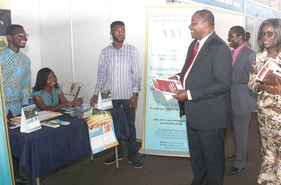 Nana Prof. Osei-Opare K. Darkwa (arrowed), Chairman of Independent Universities, and some council members at one of the exhibition stands Nana Prof. Osei-Opare K. Darkwa (arrowed), Chairman of Independent Universities, and some council members at one of the exhibition stands