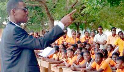 Mr Boateng (left) speaking to students about good sanitation practices Mr Boateng (left) speaking to students about good sanitation practices