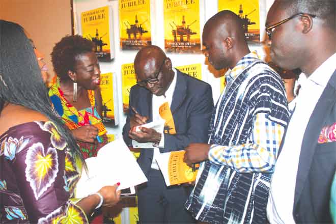 Mr George Yaw Owusu (middle), An Environmental Scientist and Author of In Pursuit of Jubilee autographing some books after the launch. Picture: EDNA ADU-SERWAA Mr George Yaw Owusu (middle), An Environmental Scientist and Author of In Pursuit of Jubilee autographing some books after the launch. Picture: EDNA ADU-SERWAA